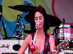 Katy Perry dancing and singing on stage in a skimpy low-cut